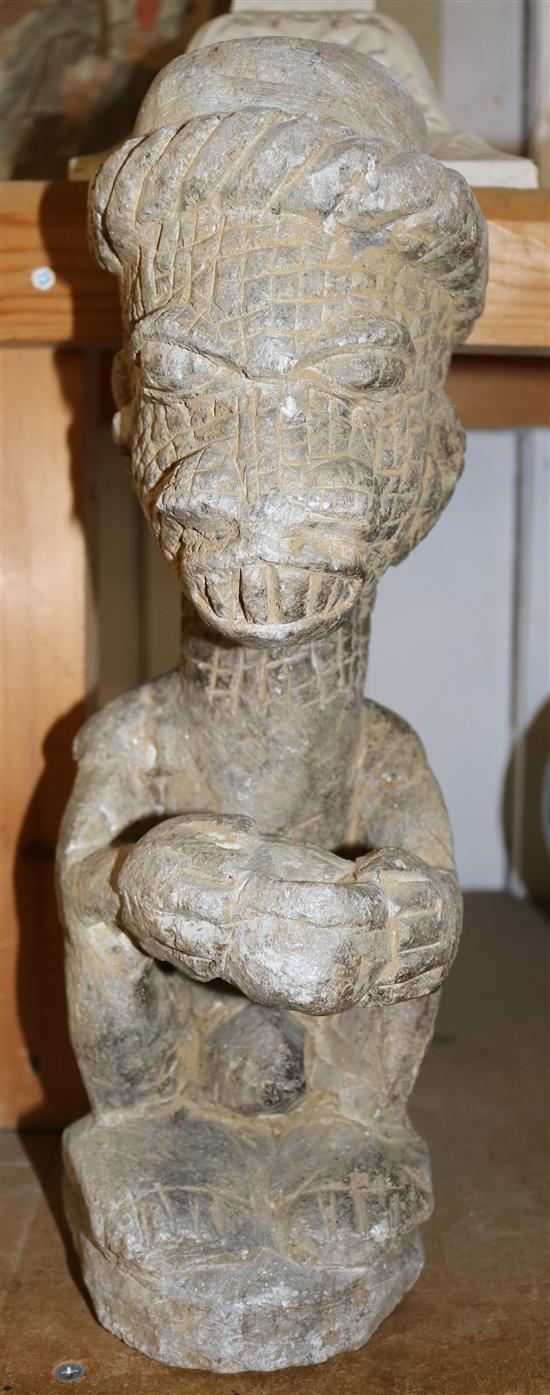 An Indonesian? stone figure(-)
